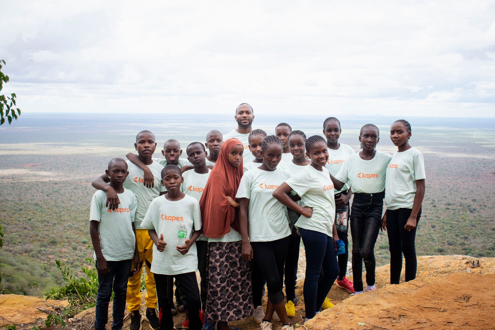 Matthew Benjamin with students from Marasi Primary School